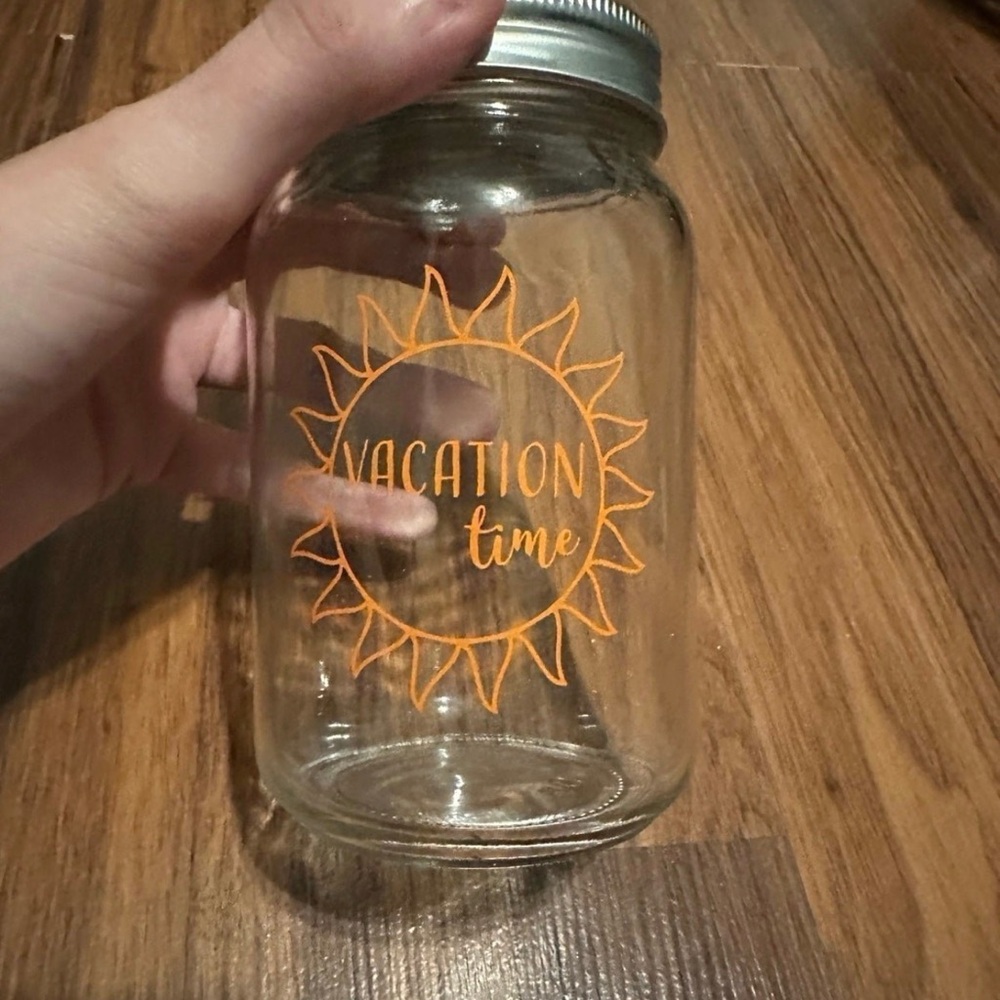 Glass Jar with Orange Sun Design